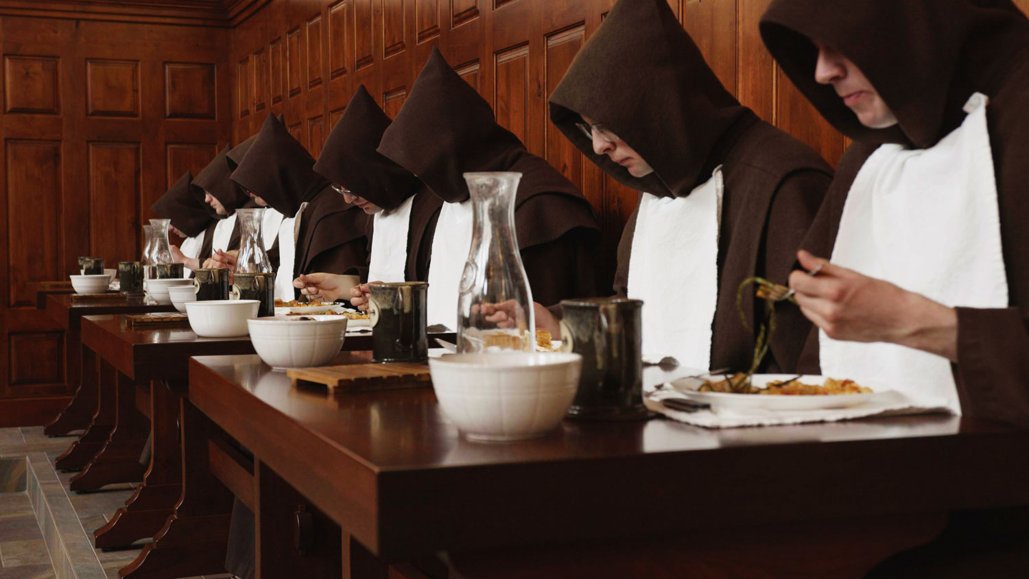 Monks eating in the refectory.